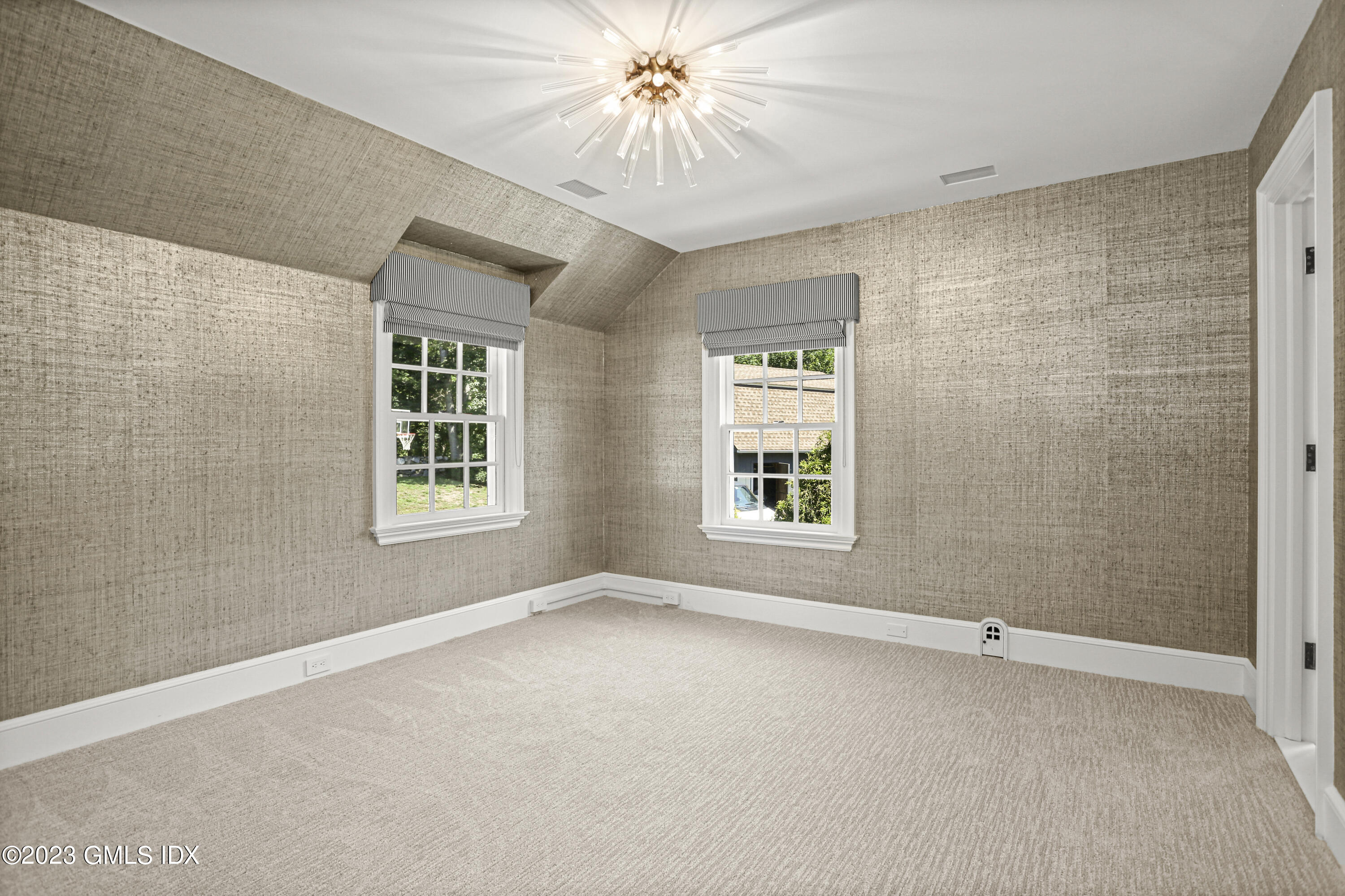 26 Memory Lane Greenwich, CT 06831 - Photo 17 of 43 a view of a livingroom with a ceiling fan and window