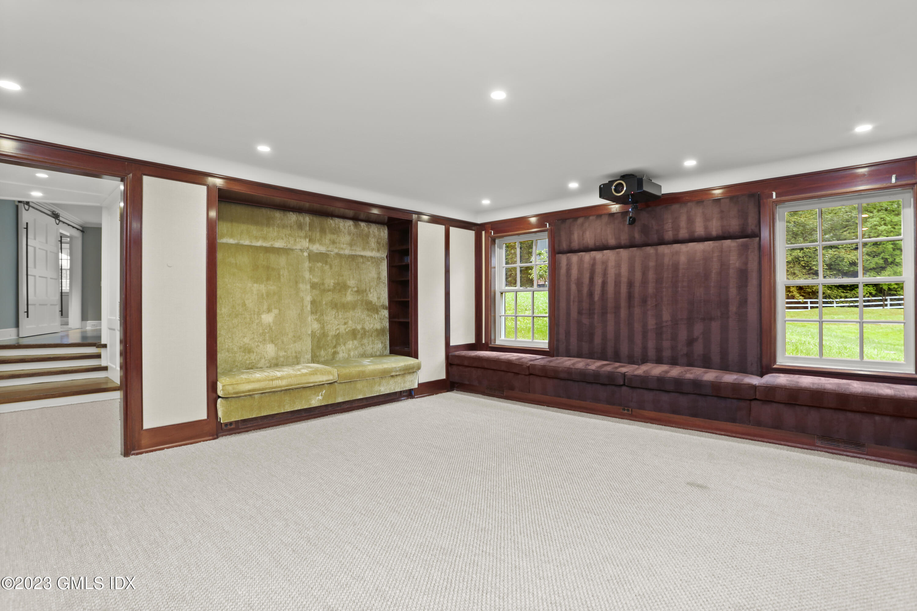 26 Memory Lane Greenwich, CT 06831 - Photo 25 of 43 a view of an empty room with a window and a fireplace