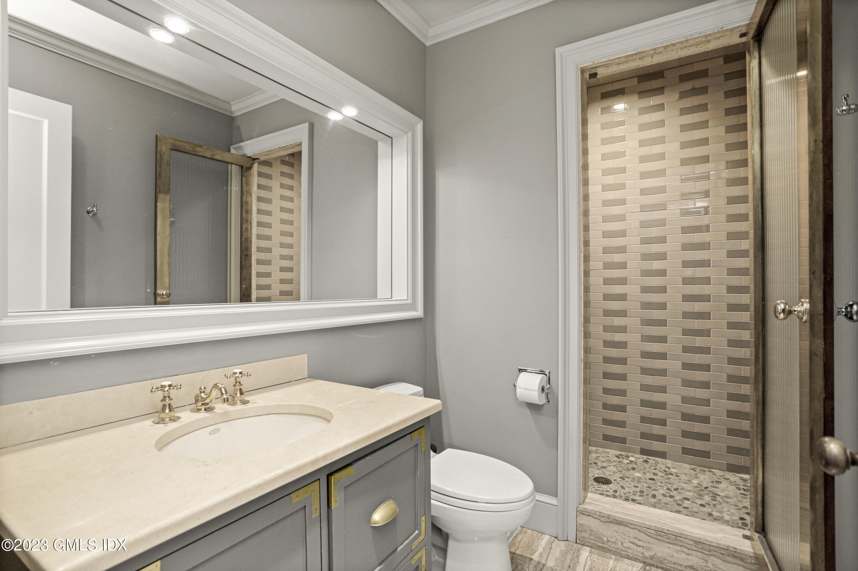 26 Memory Lane Greenwich, CT 06831 - Photo 28 of 43 a bathroom with a granite countertop sink toilet and shower