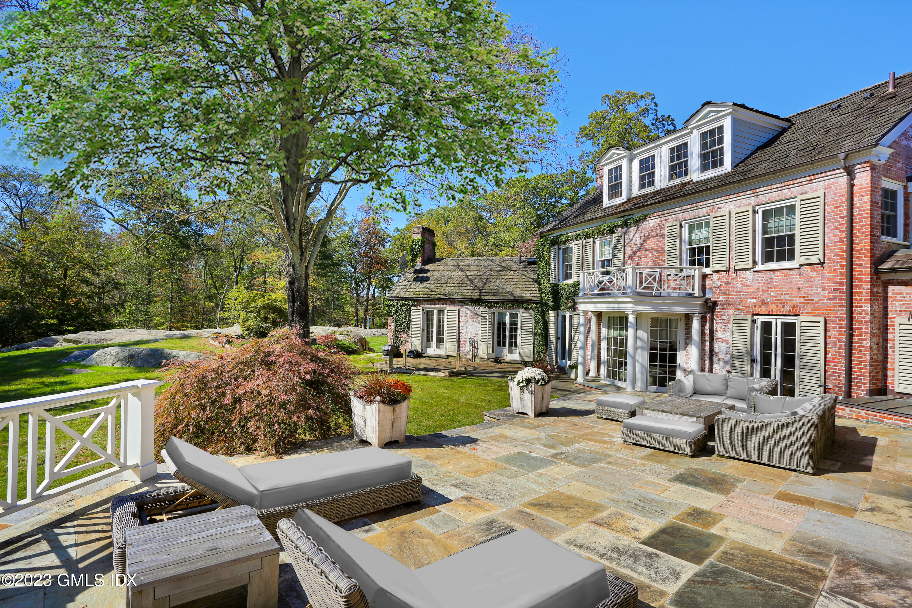 26 Memory Lane Greenwich, CT 06831 - Photo 29 of 43 a view of a house with backyard and sitting area