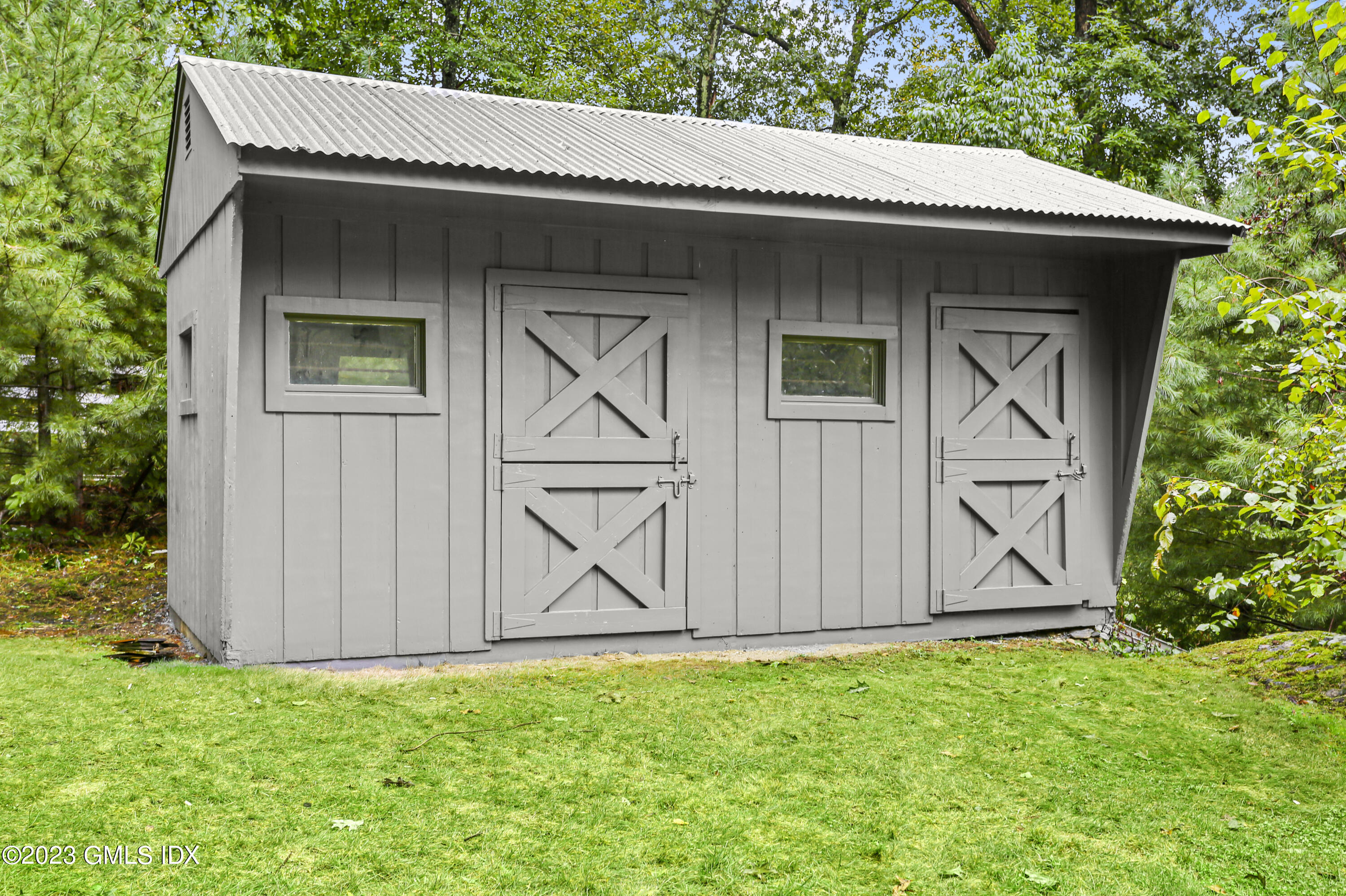 26 Memory Lane Greenwich, CT 06831 - Photo 33 of 43 a view of front of house with swing