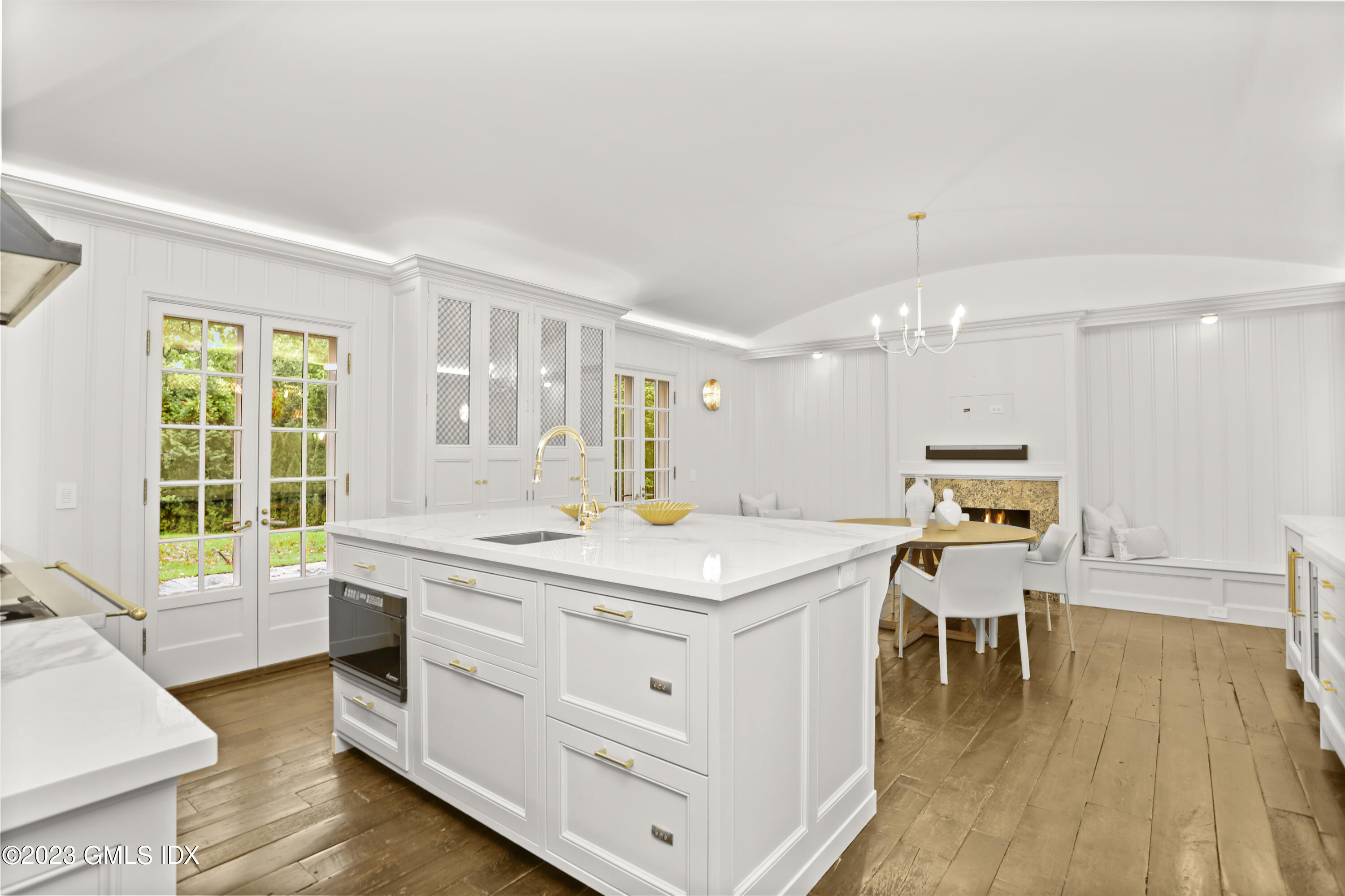 26 Memory Lane Greenwich, CT 06831 - Photo 6 of 43 a kitchen with a stove and wooden floor