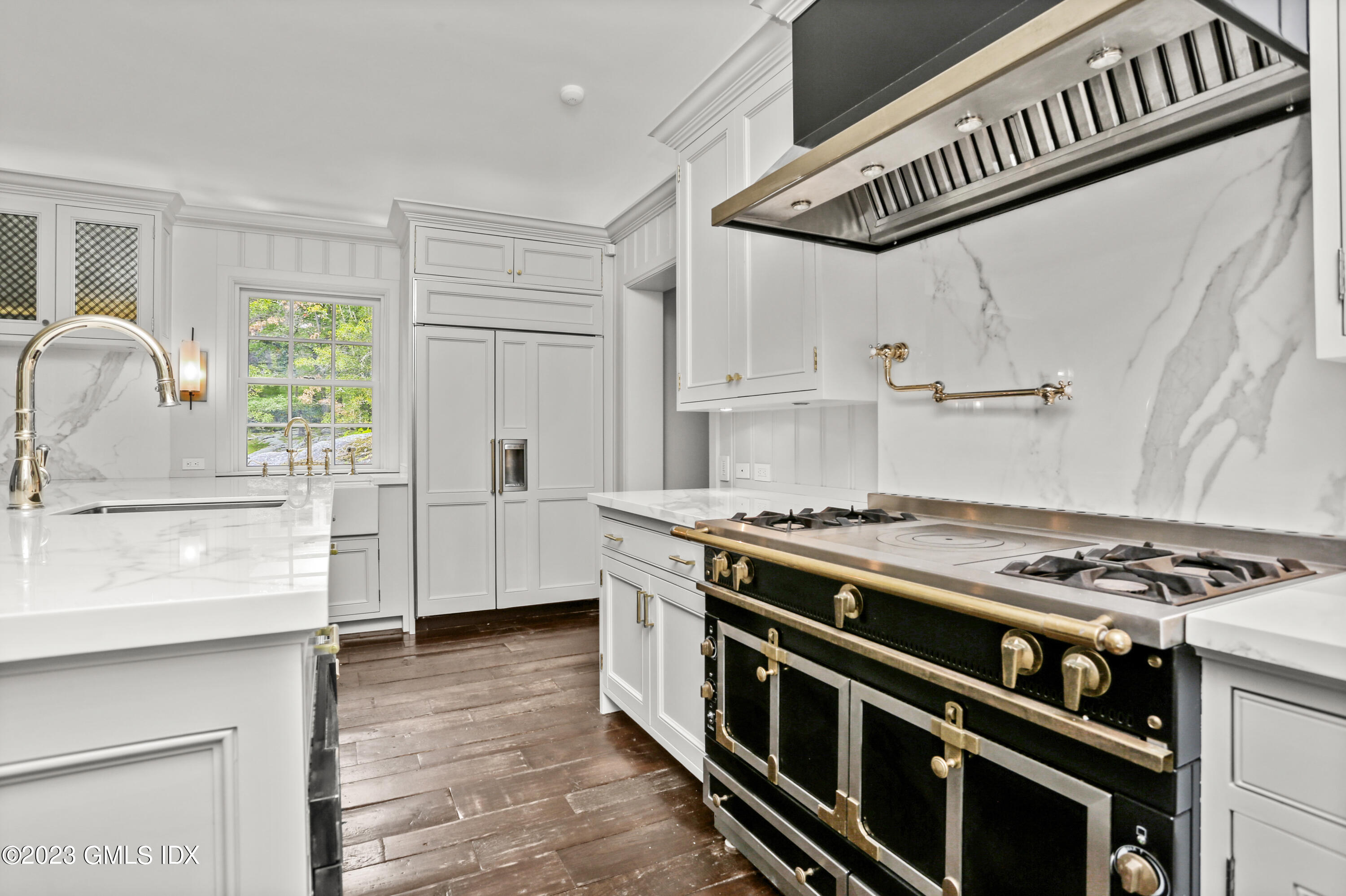 26 Memory Lane Greenwich, CT 06831 - Photo 8 of 43 a kitchen with stainless steel appliances a stove a sink and a refrigerator