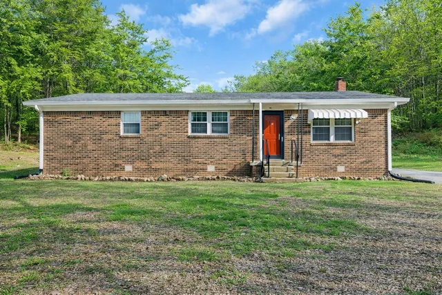 a backyard of a house with seating space