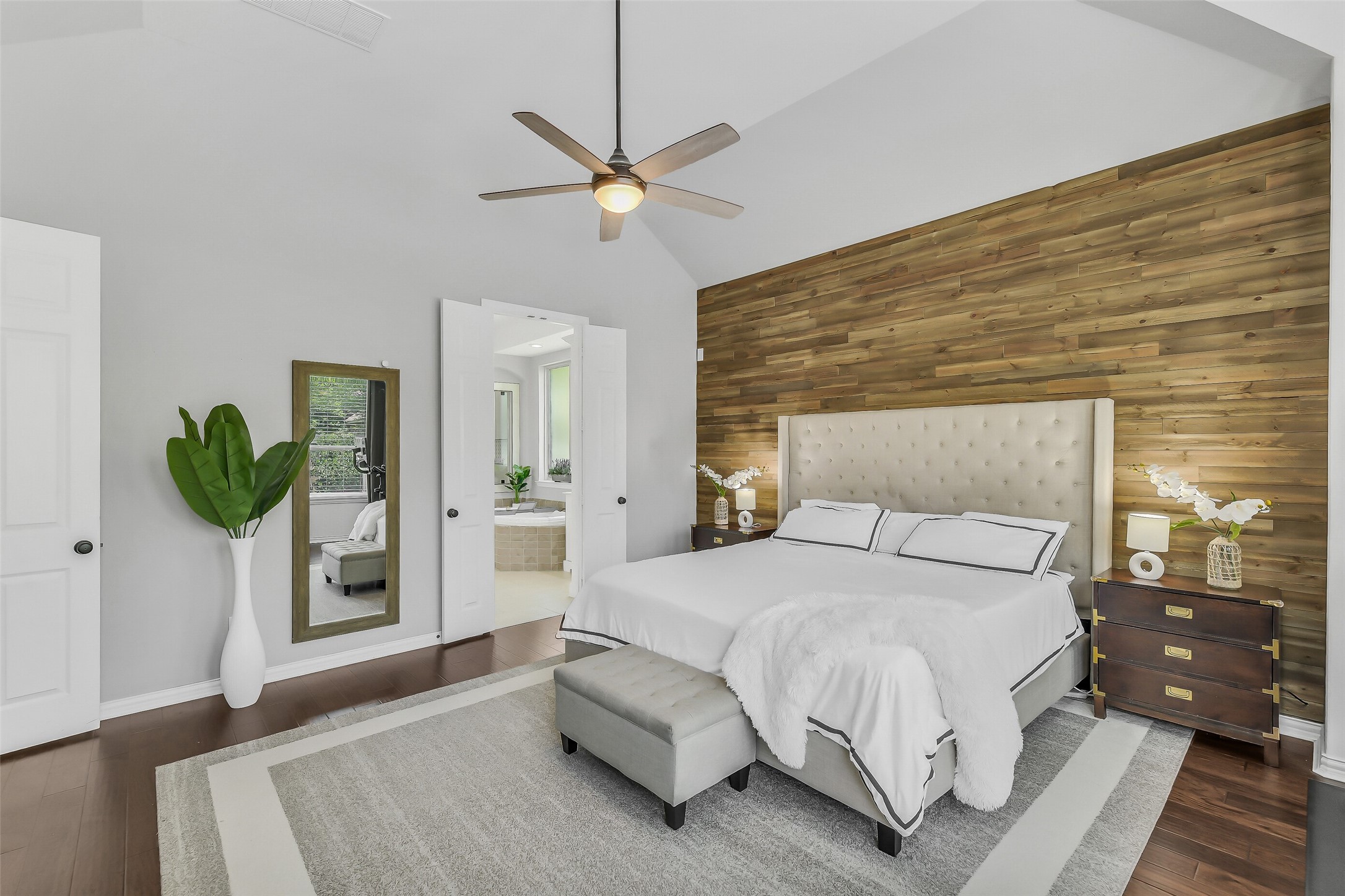 12207 Shorebridge Road Cypress, TX 77433 - Photo 19 of 41 a bedroom with a bed and a potted plant