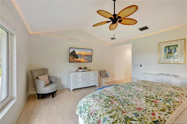 a bedroom with bed and window