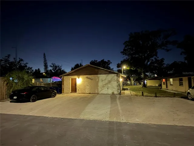 a view of a street with cars parked