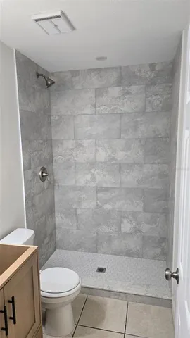 a view of a utility room with cabinets