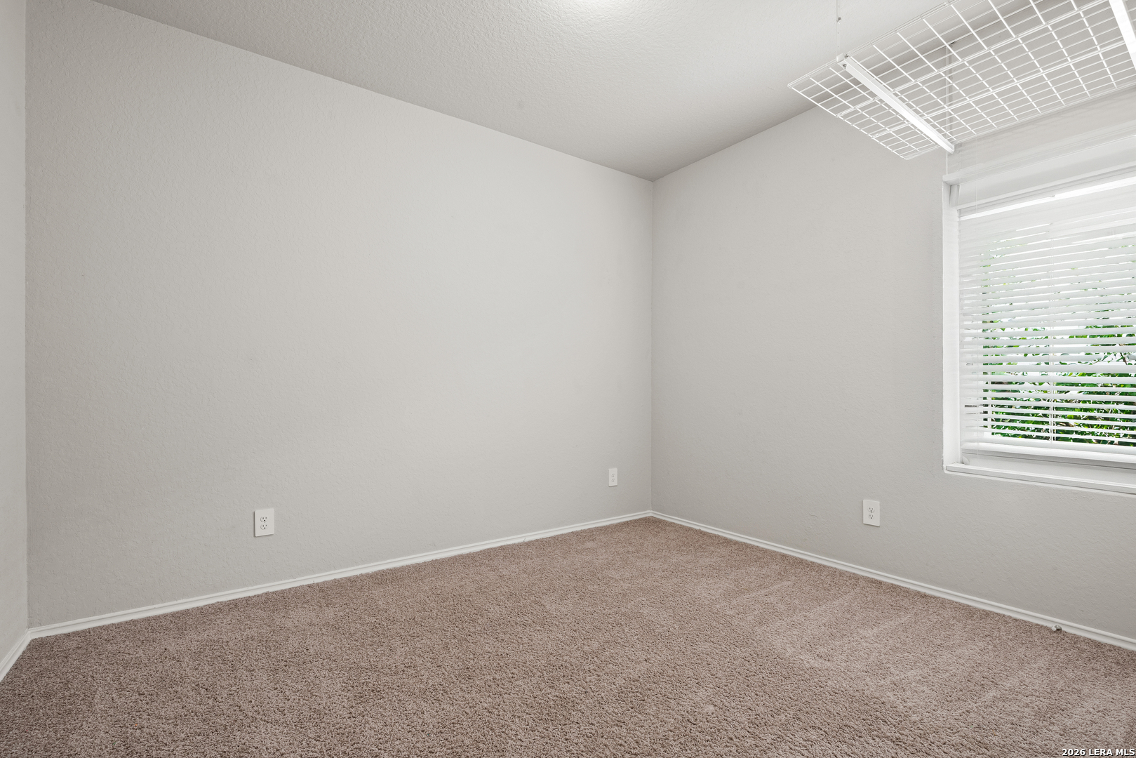 14606 Hackamore Way Elmendorf, TX 78112 - Photo 15 of 18 an empty room with a window