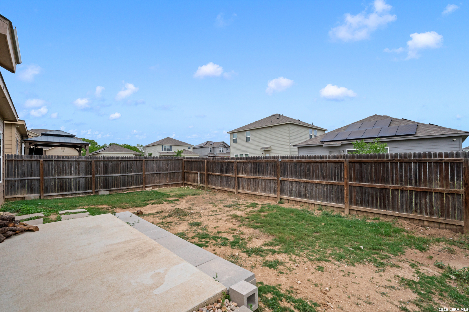 14606 Hackamore Way Elmendorf, TX 78112 - Photo 17 of 18 a view of a backyard with a garden