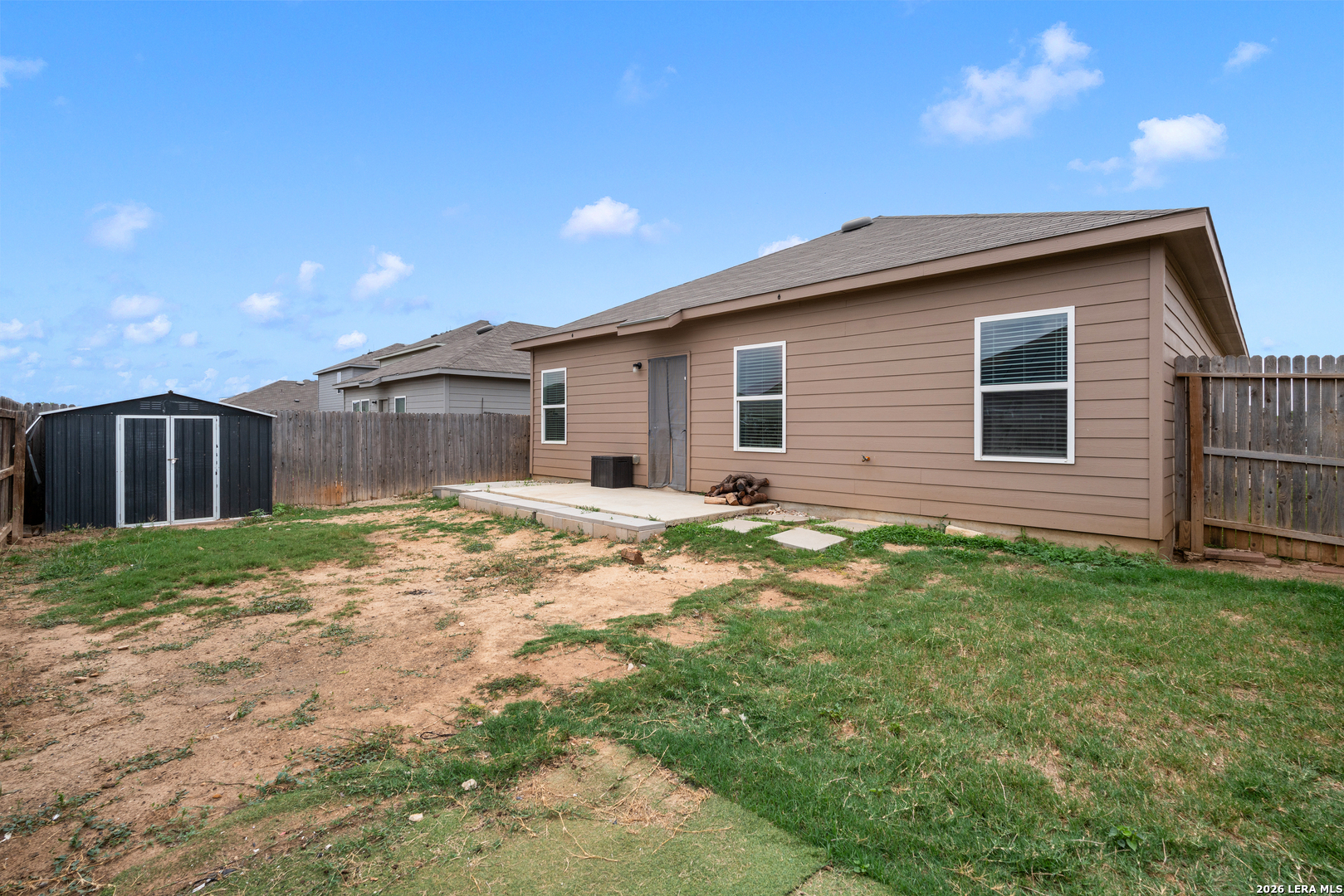 14606 Hackamore Way Elmendorf, TX 78112 - Photo 18 of 18 a backyard of a house with lots of green space