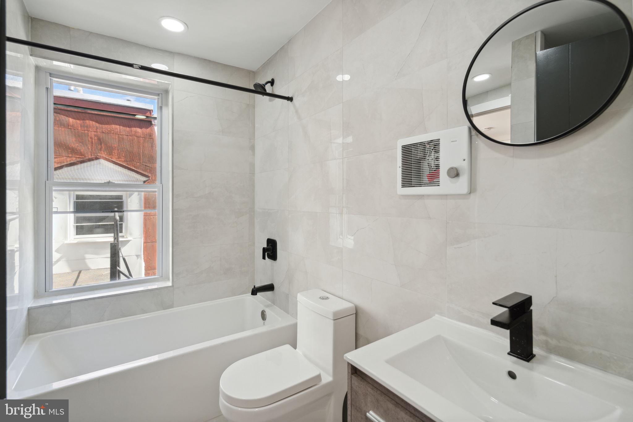 1908 Pine Street, Unit 6 Philadelphia, PA 19103 - Photo 12 of 24 a bathroom with a sink toilet and shower