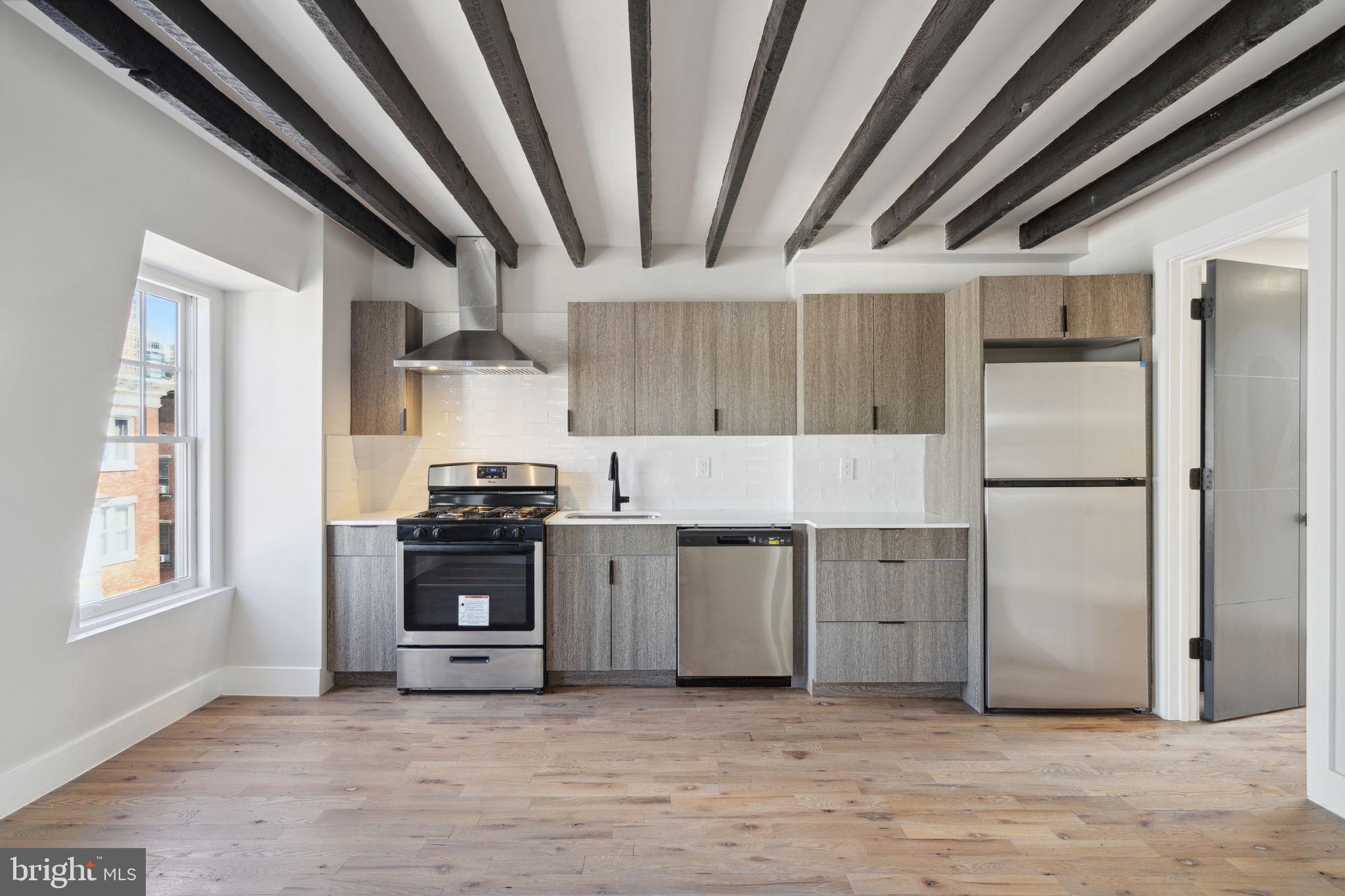 1908 Pine Street, Unit 6 Philadelphia, PA 19103 - Photo 2 of 24 a kitchen with stove and refrigerator