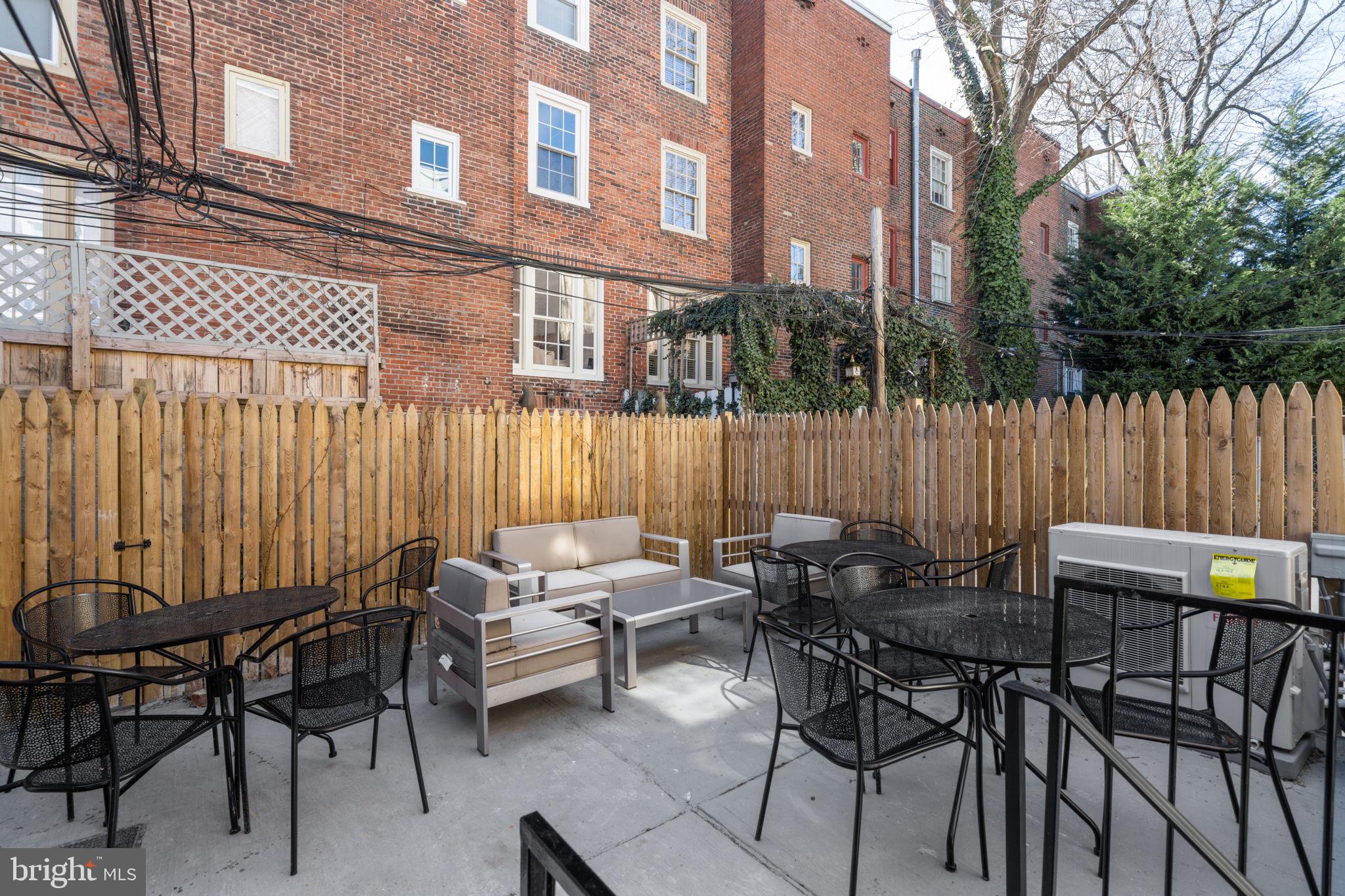 1908 Pine Street, Unit 6 Philadelphia, PA 19103 - Photo 22 of 24 a view of a patio with a table and chairs