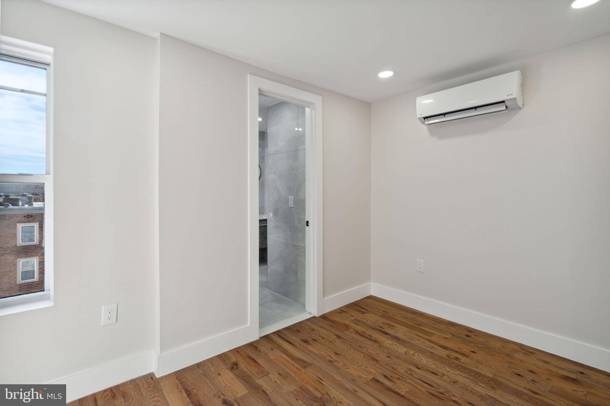 1908 Pine Street, Unit 6 Philadelphia, PA 19103 - Photo 9 of 24 a view of hallway with wooden floor and a window