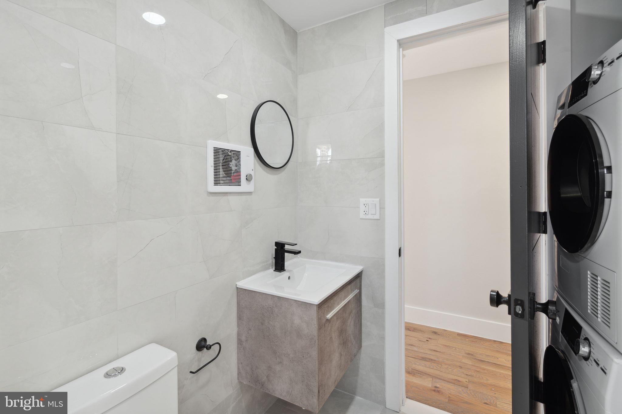 1908 Pine Street, Unit 6 Philadelphia, PA 19103 - Photo 10 of 24 a bathroom with a sink a toilet and shower