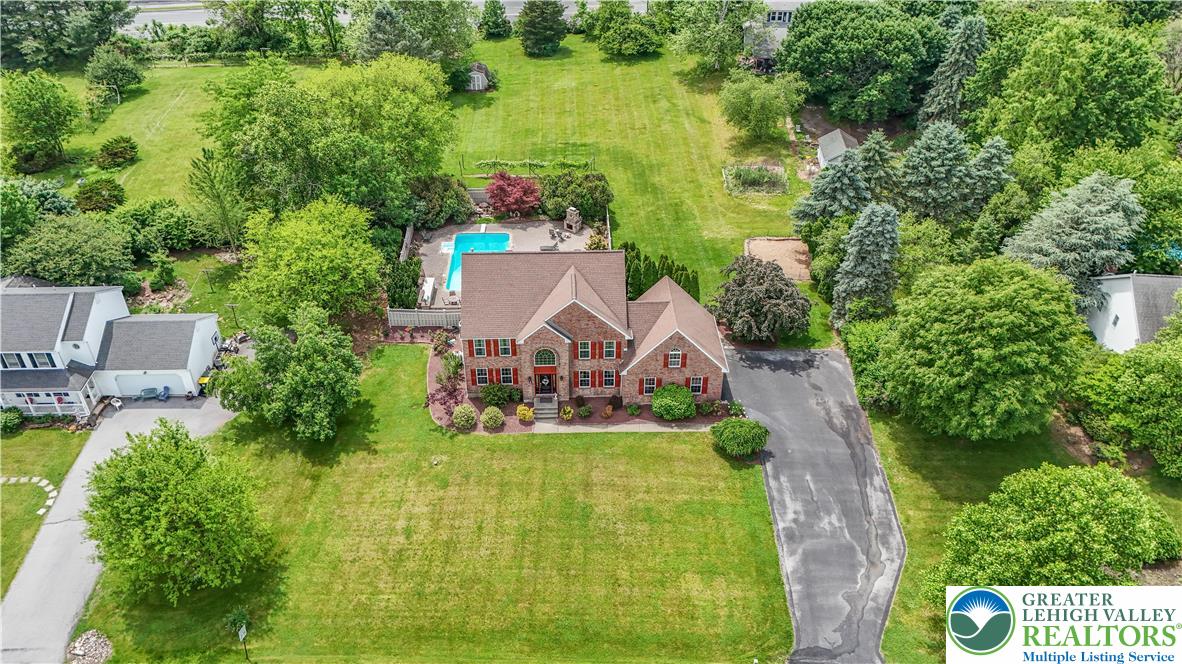 3830 McIntosh Drive Orefield, PA 18069 - Photo 36 of 36 an aerial view of a house with a yard basket ball court and outdoor seating