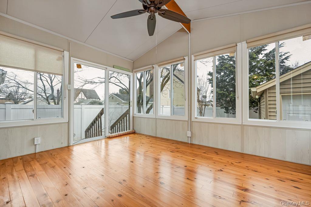 315 Marcellus Road Mineola, NY 11501 - Photo 11 of 18 a view of an empty room with a window and wooden floor