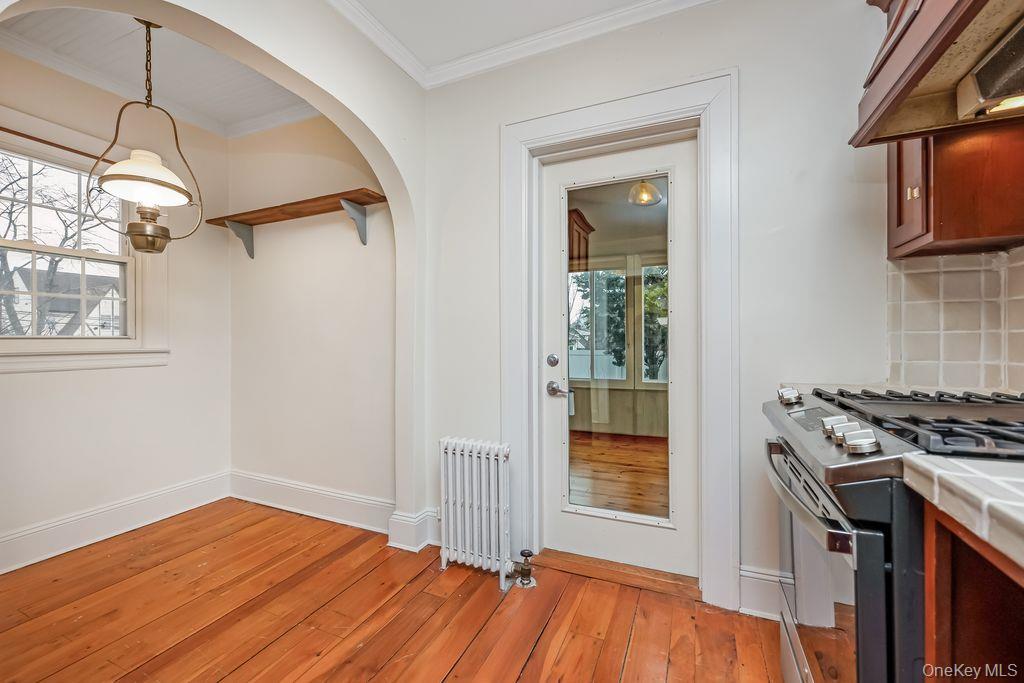 315 Marcellus Road Mineola, NY 11501 - Photo 10 of 18 a kitchen that has a stove and a wooden floor