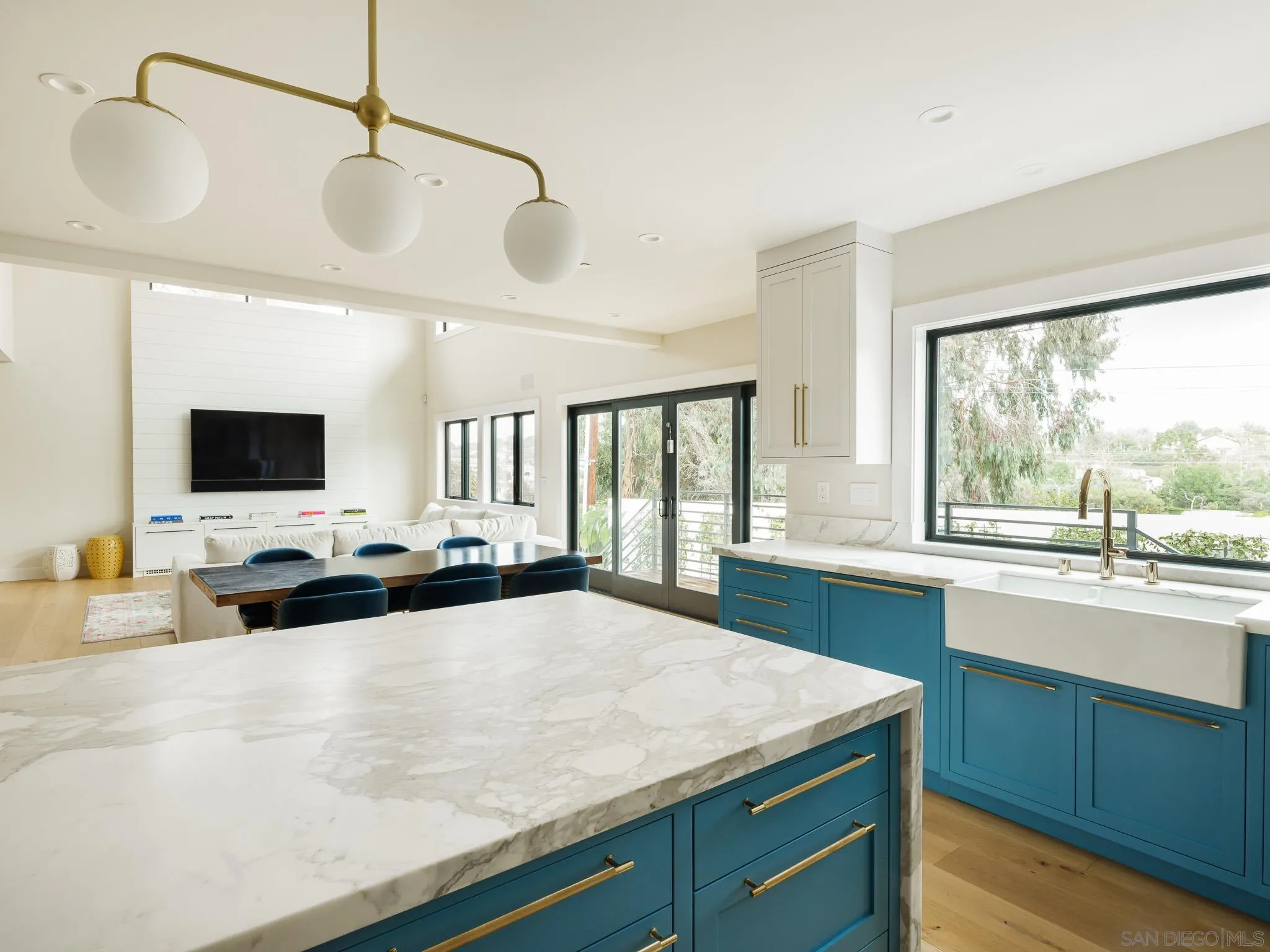 631 Stratford Drive Encinitas, CA 92024 - Photo 17 of 52 a large kitchen with kitchen island a large counter space a sink and a stove