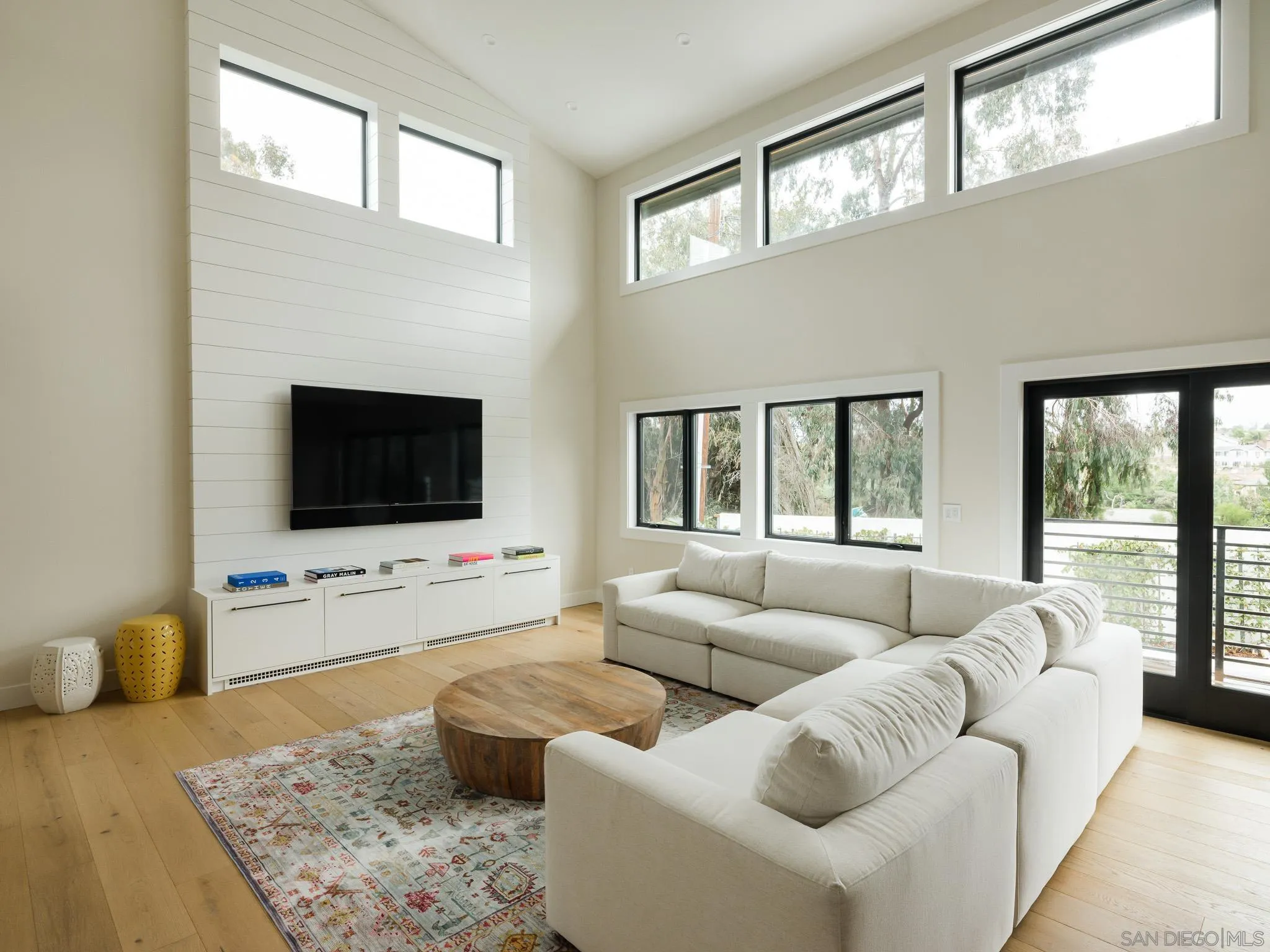 631 Stratford Drive Encinitas, CA 92024 - Photo 2 of 52 a living room with furniture and a flat screen tv