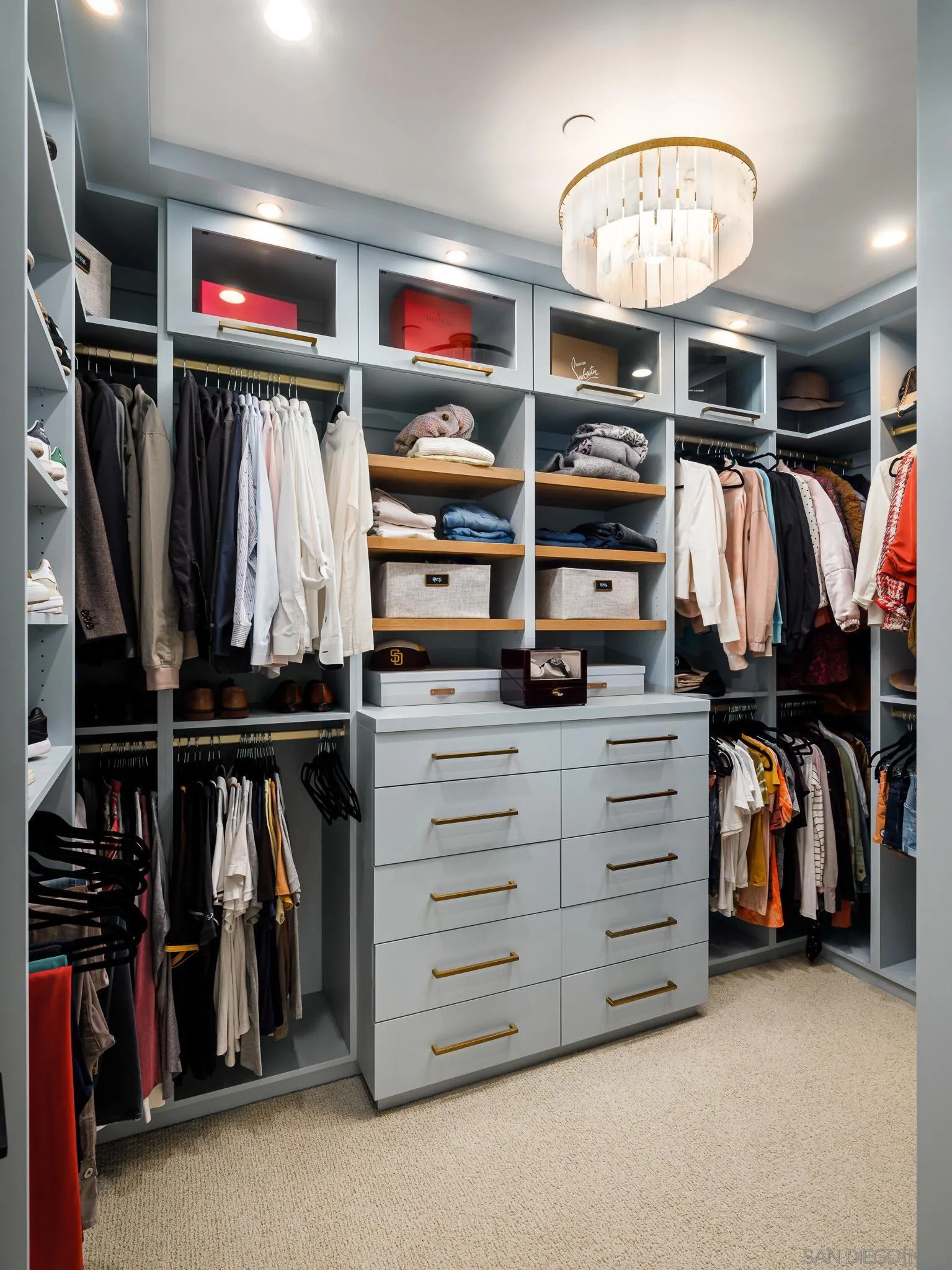 631 Stratford Drive Encinitas, CA 92024 - Photo 25 of 52 a view of walk in closet with clothes and shoes