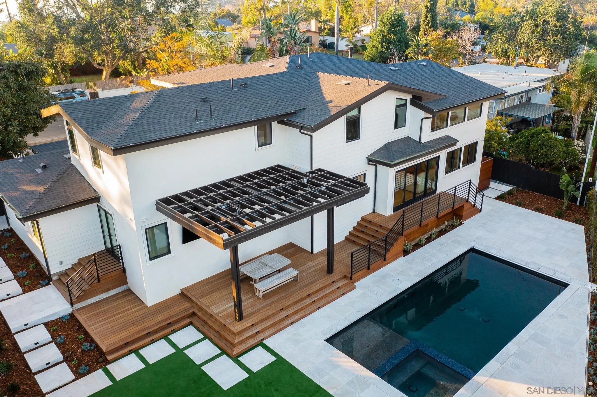 631 Stratford Drive Encinitas, CA 92024 - Photo 49 of 52 a view of a patio with table and chairs and wooden fence