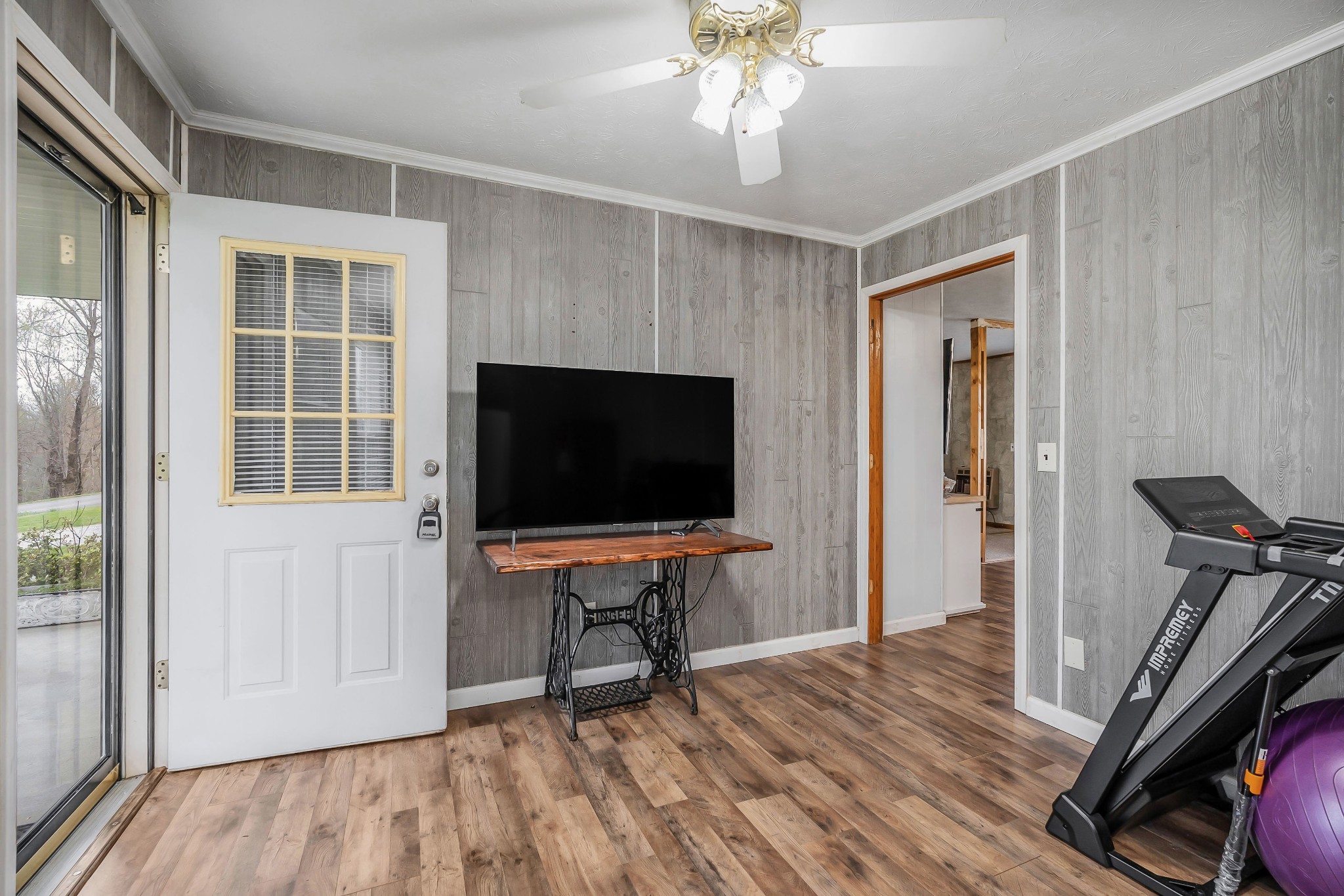 12245 Hopewell Road Silver Point, TN 38582 - Photo 5 of 56 a view of a livingroom with furniture and a flat screen tv