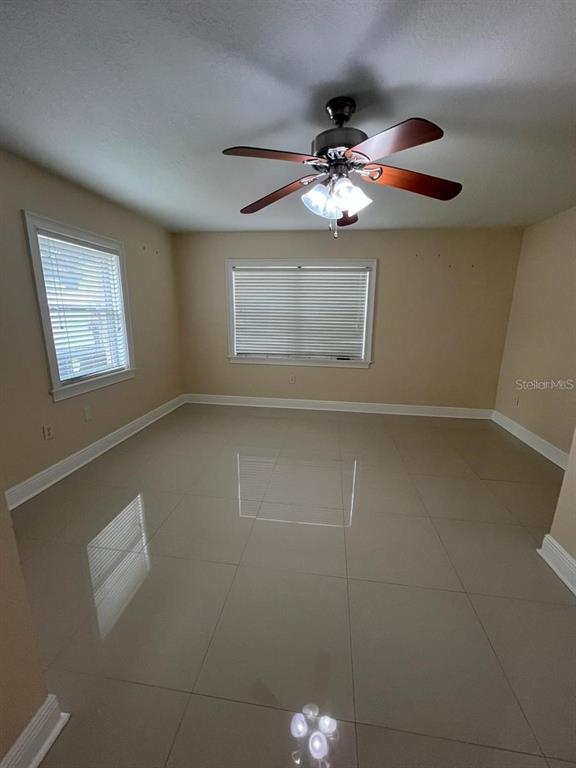 5602 Joyner Road Tampa, FL 33624 - Photo 11 of 28 a view of an empty room with a window