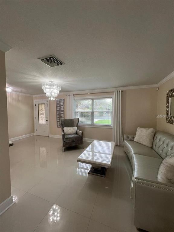 5602 Joyner Road Tampa, FL 33624 - Photo 13 of 28 a living room with furniture and a large window