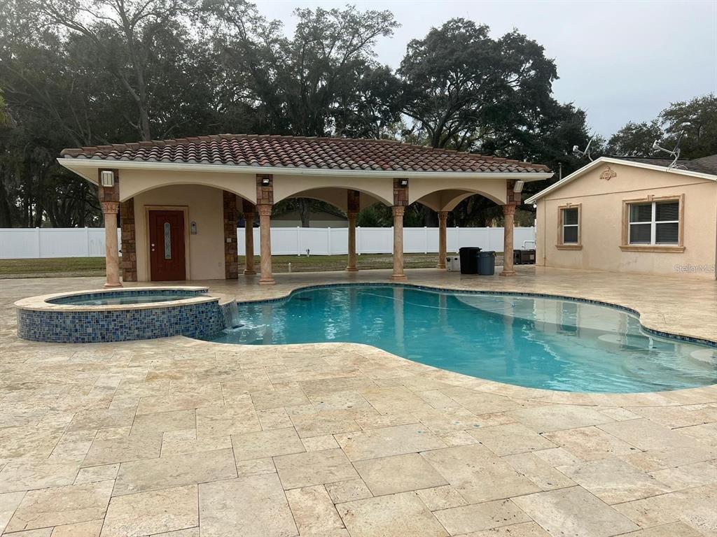 5602 Joyner Road Tampa, FL 33624 - Photo 2 of 28 a front view of a house with a yard