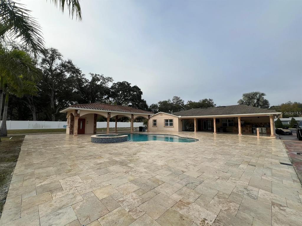 5602 Joyner Road Tampa, FL 33624 - Photo 3 of 28 a front view of a house with yard