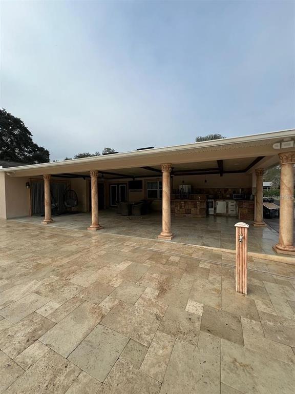 5602 Joyner Road Tampa, FL 33624 - Photo 8 of 28 a view of house with outdoor space