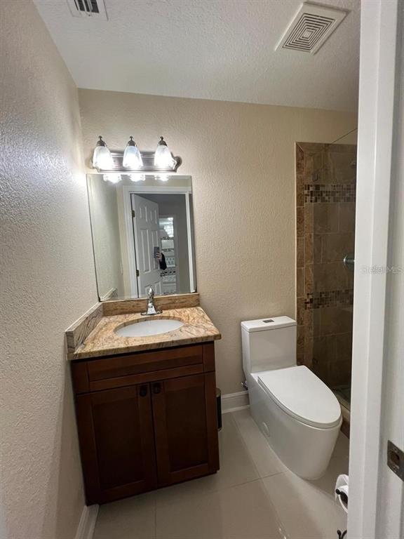 5602 Joyner Road Tampa, FL 33624 - Photo 10 of 28 a room with a sink and a toilet