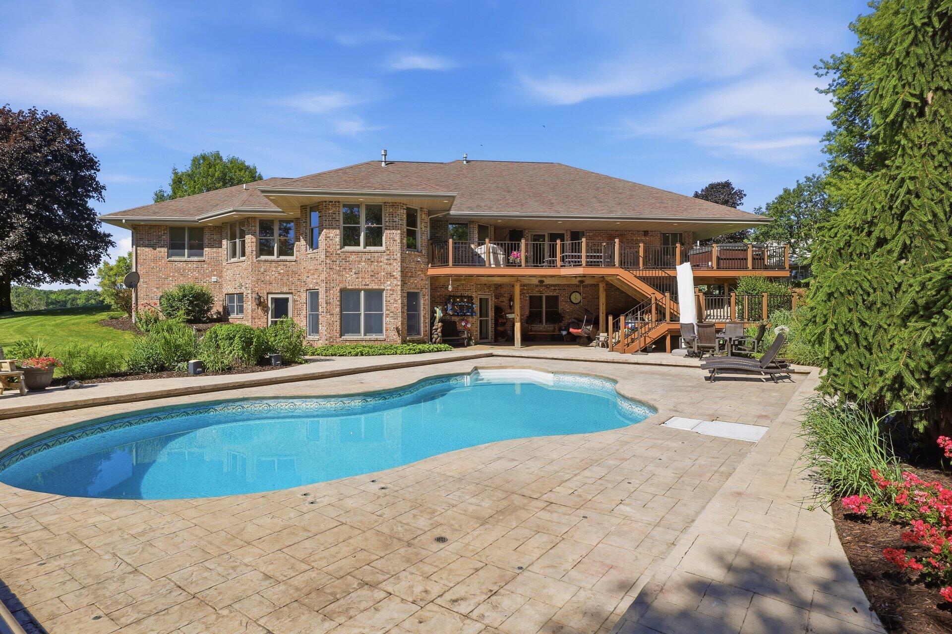 9325 East Six Corners Road Johnstown, WI 53563 - Photo 2 of 42 Back walkout and pool