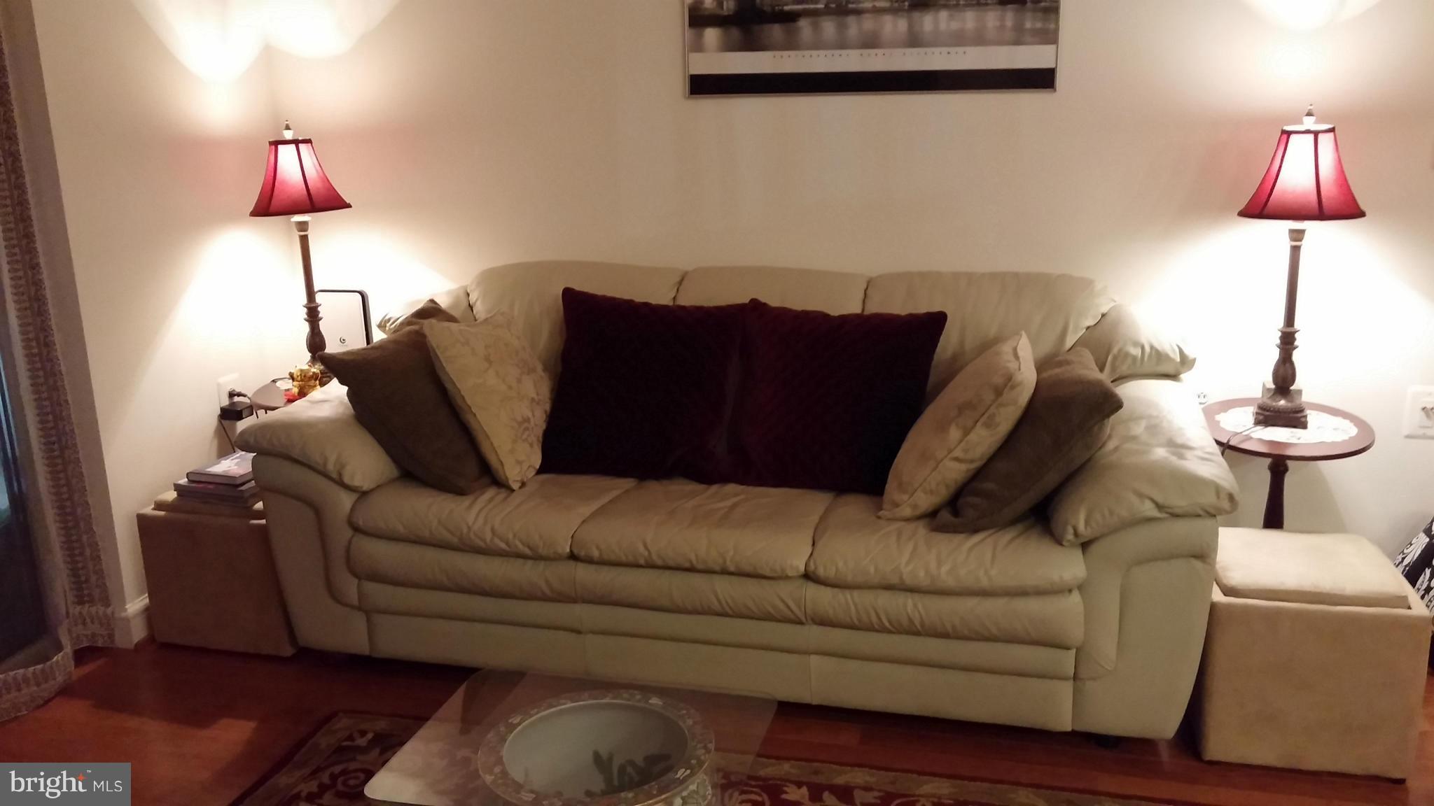 11990 Market Street, Unit 208 Reston, VA 20190 - Photo 15 of 30 Living Room with leather sofa