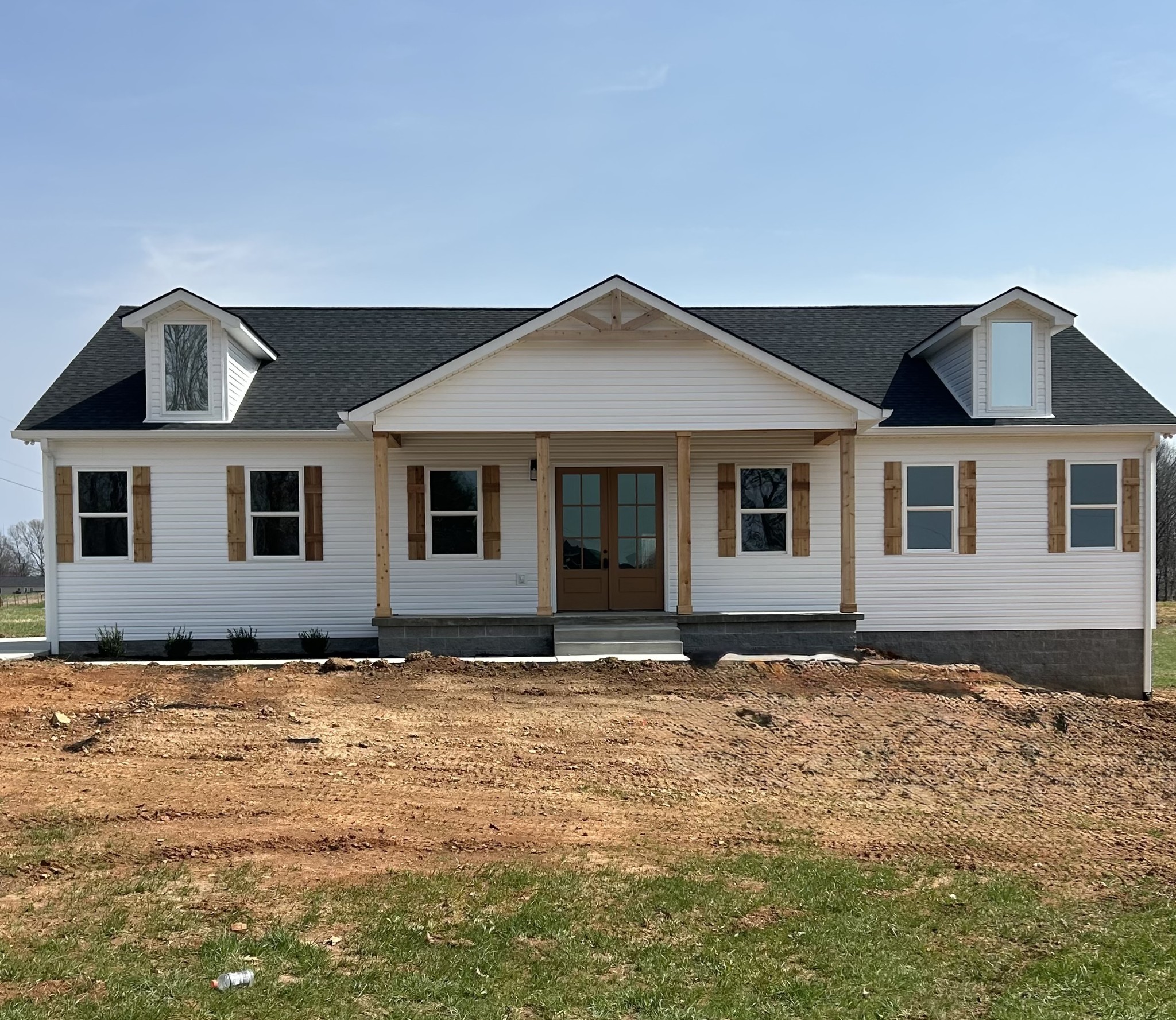 a front view of a house with a yard