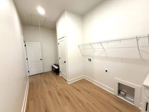 an empty room with wooden floor