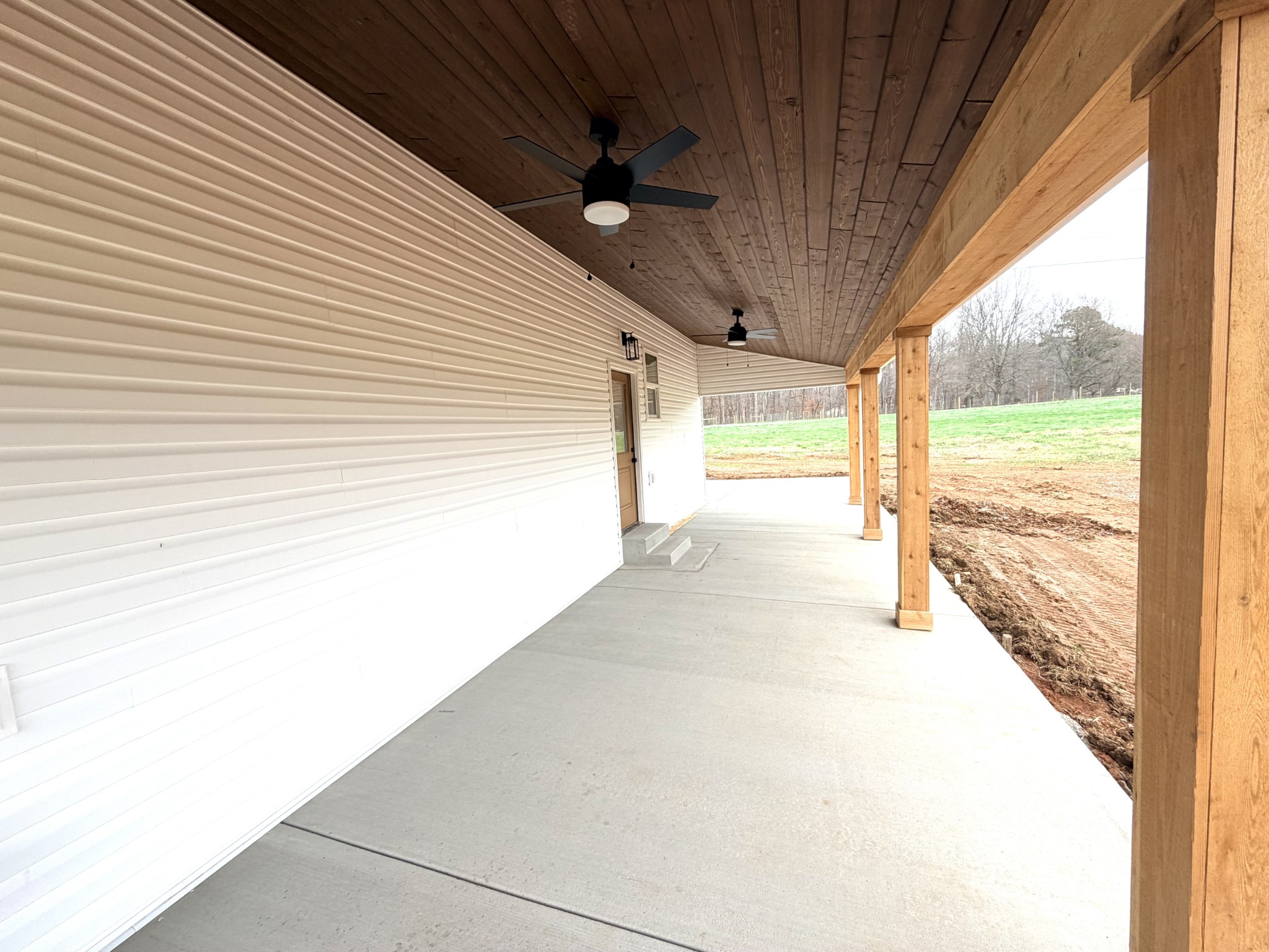 4031 Wells Road Springfield, TN 37172 - Photo 22 of 23 a view of a big room with wooden floor and windows