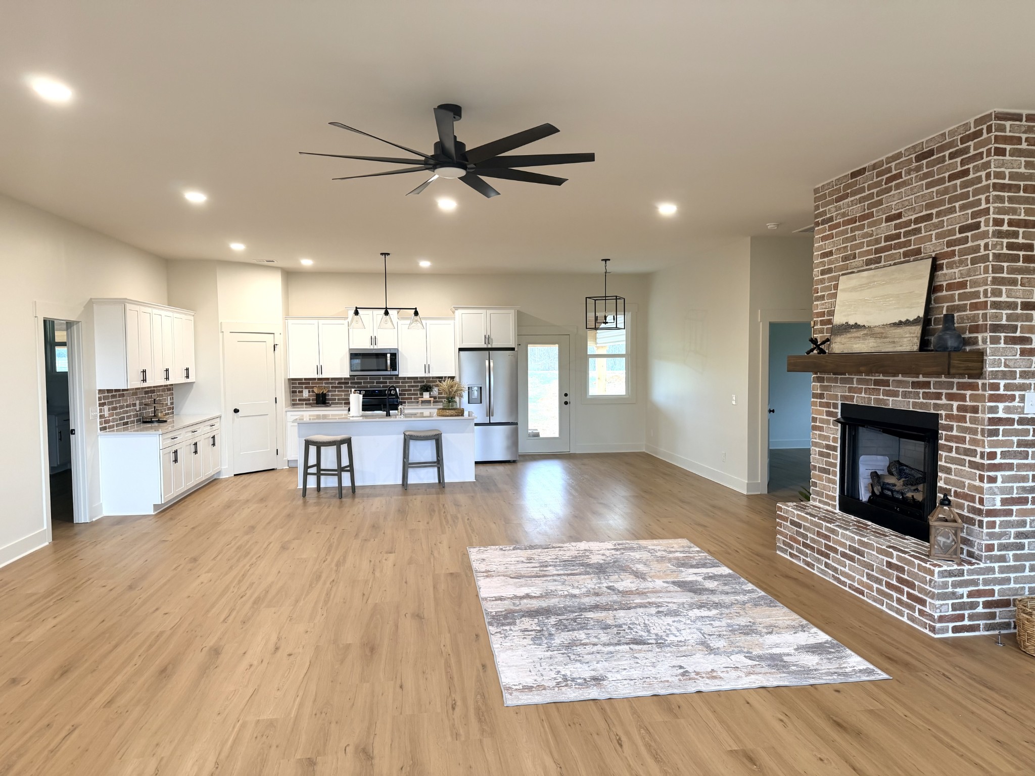 4031 Wells Road Springfield, TN 37172 - Photo 4 of 23 a living room with stainless steel appliances kitchen island furniture and a fireplace