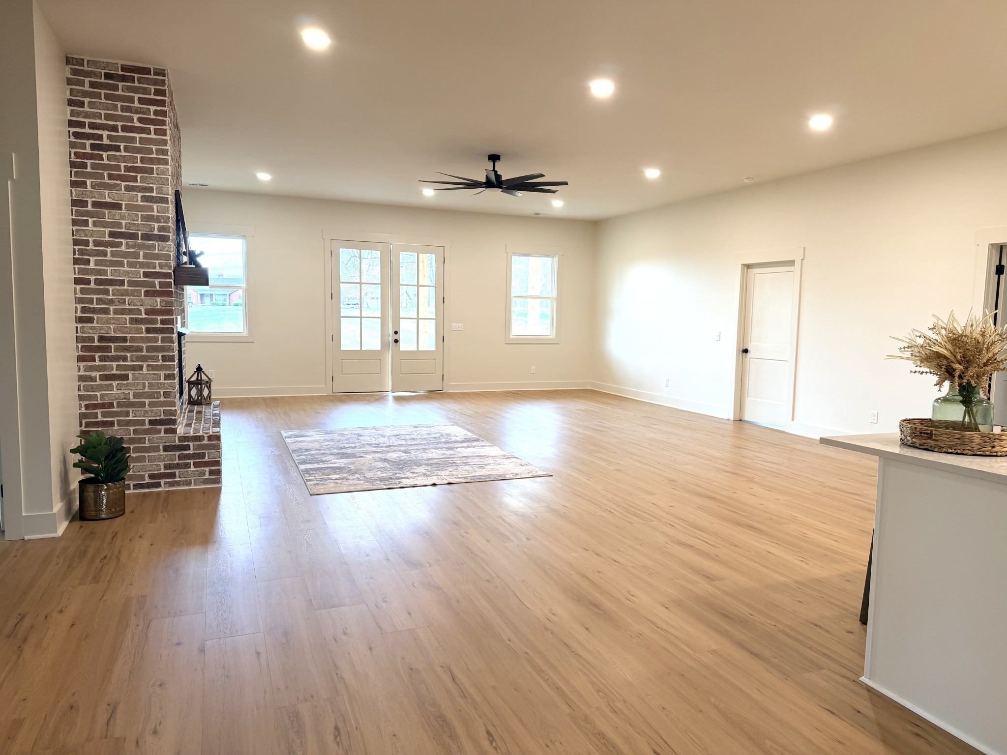 4031 Wells Road Springfield, TN 37172 - Photo 6 of 23 an empty room with wooden floor and windows