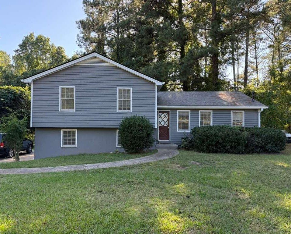 3990 Highway 92 Acworth, GA 30102 - Photo 1 of 26 a front view of a house with a garden and yard