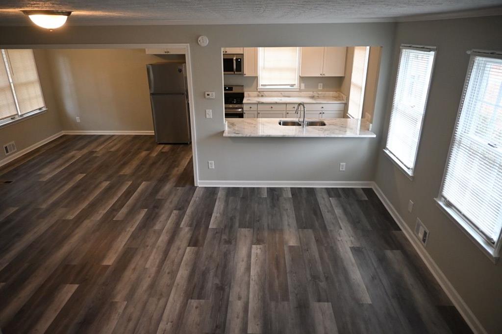 3990 Highway 92 Acworth, GA 30102 - Photo 4 of 26 a view of a kitchen with wooden floor and electronic appliances
