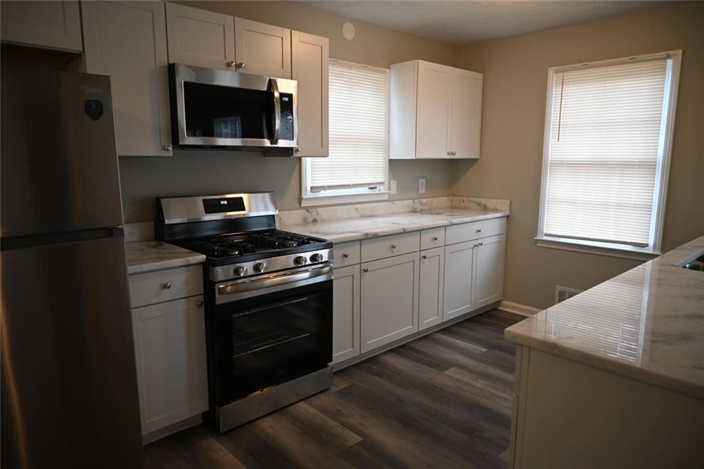 3990 Highway 92 Acworth, GA 30102 - Photo 5 of 26 a kitchen with a sink stove and microwave