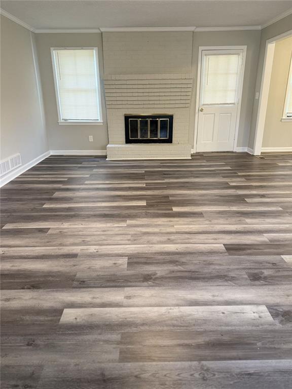3990 Highway 92 Acworth, GA 30102 - Photo 8 of 26 a view of empty room with wooden floor and fireplace