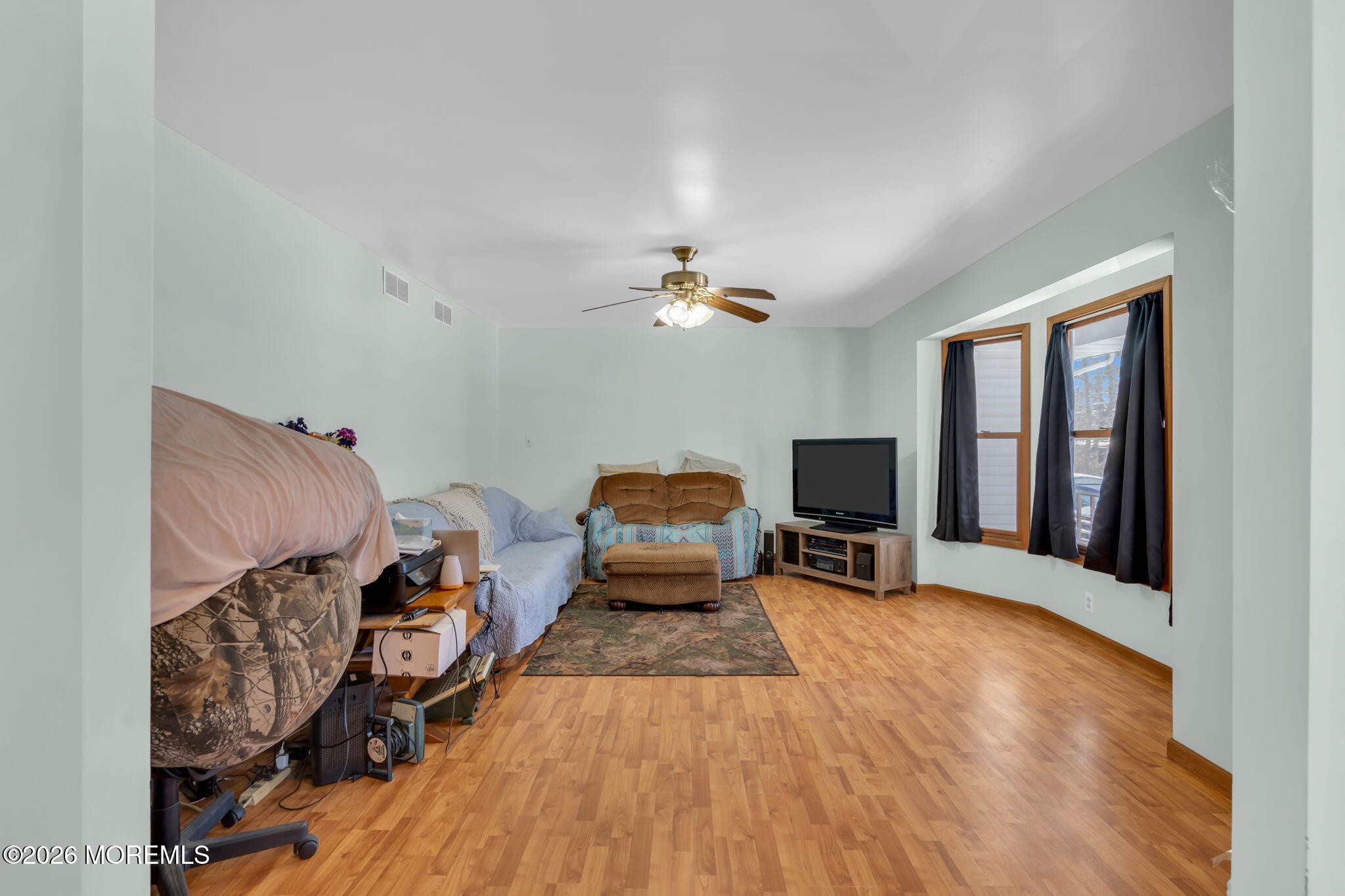 177 Cedar Swamp Road Jackson, NJ 08527 - Photo 12 of 27 a living room with furniture and a flat screen tv