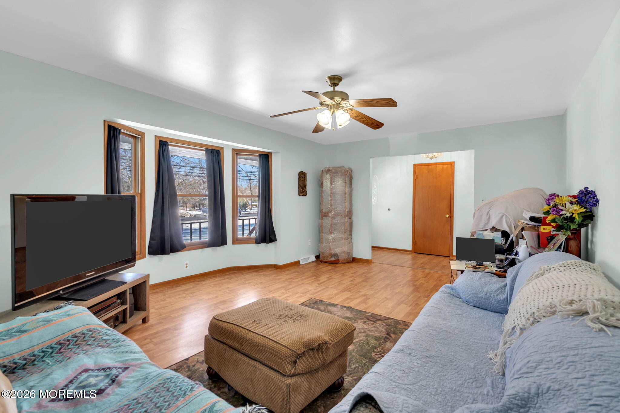 177 Cedar Swamp Road Jackson, NJ 08527 - Photo 14 of 27 a living room with furniture chandelier and a flat screen tv