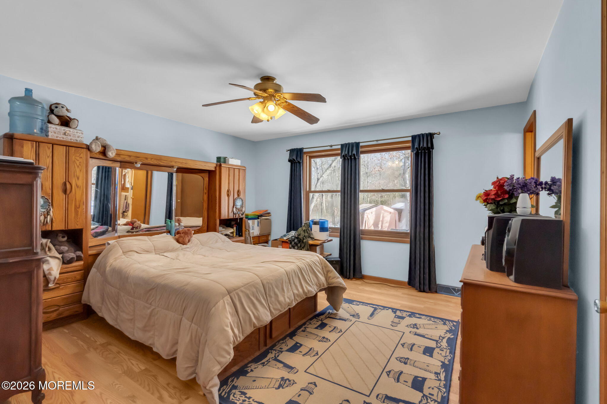 177 Cedar Swamp Road Jackson, NJ 08527 - Photo 19 of 27 a bedroom with a bed and a large mirror on the dresser