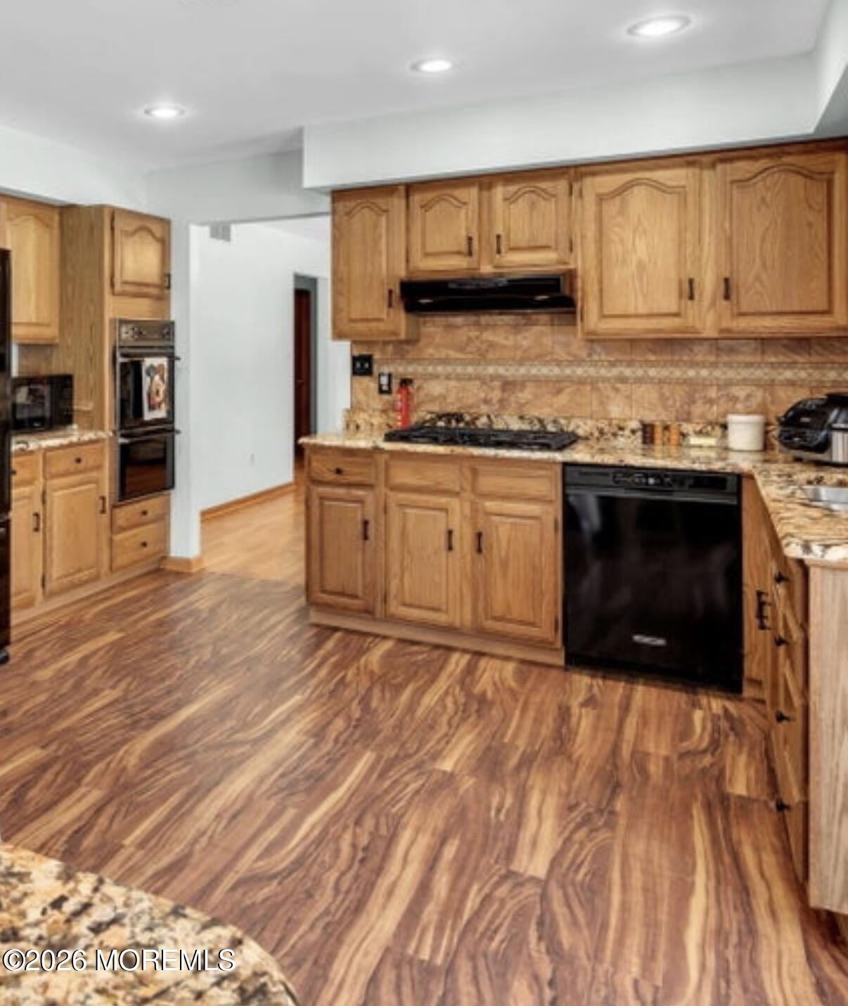 177 Cedar Swamp Road Jackson, NJ 08527 - Photo 2 of 27 a kitchen with stainless steel appliances granite countertop a stove a sink and a microwave