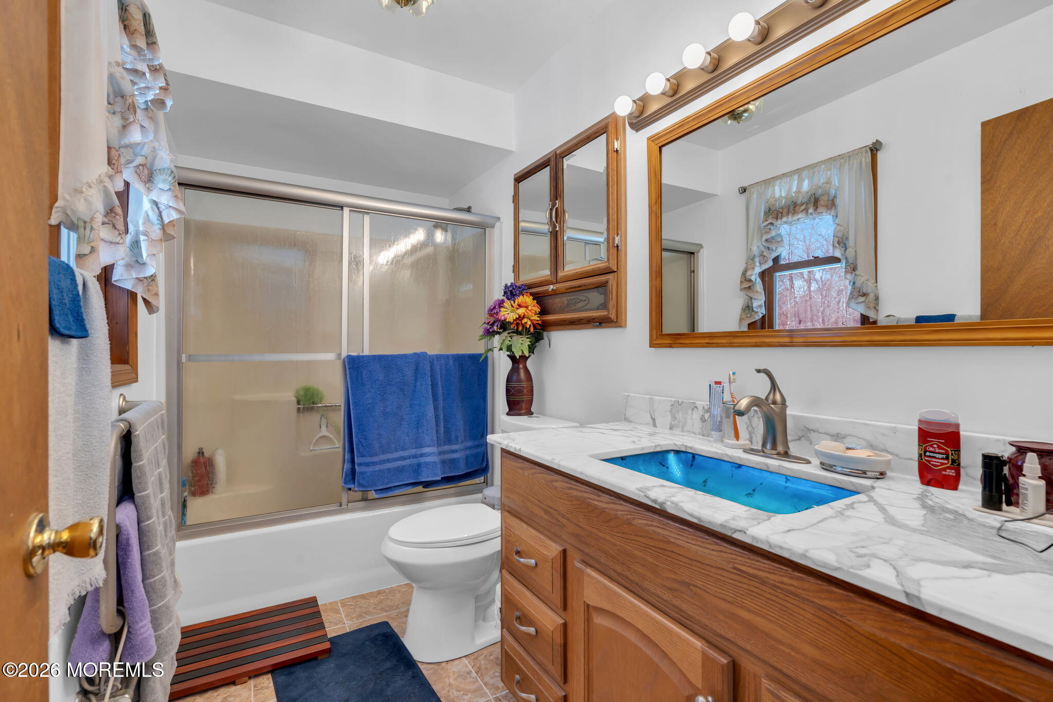 177 Cedar Swamp Road Jackson, NJ 08527 - Photo 21 of 27 a bathroom with a sink a toilet and shower curtain